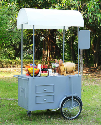 Chariot de poussée à la main pour la nourriture de rue 3 roues Chariot de chargement avec boîte de rangement pour la promotion de vente.
