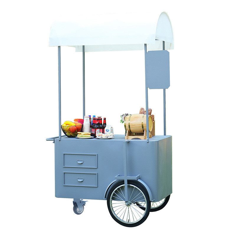 Chariot de poussée à la main pour la nourriture de rue 3 roues Chariot de chargement avec boîte de rangement pour la promotion de vente.